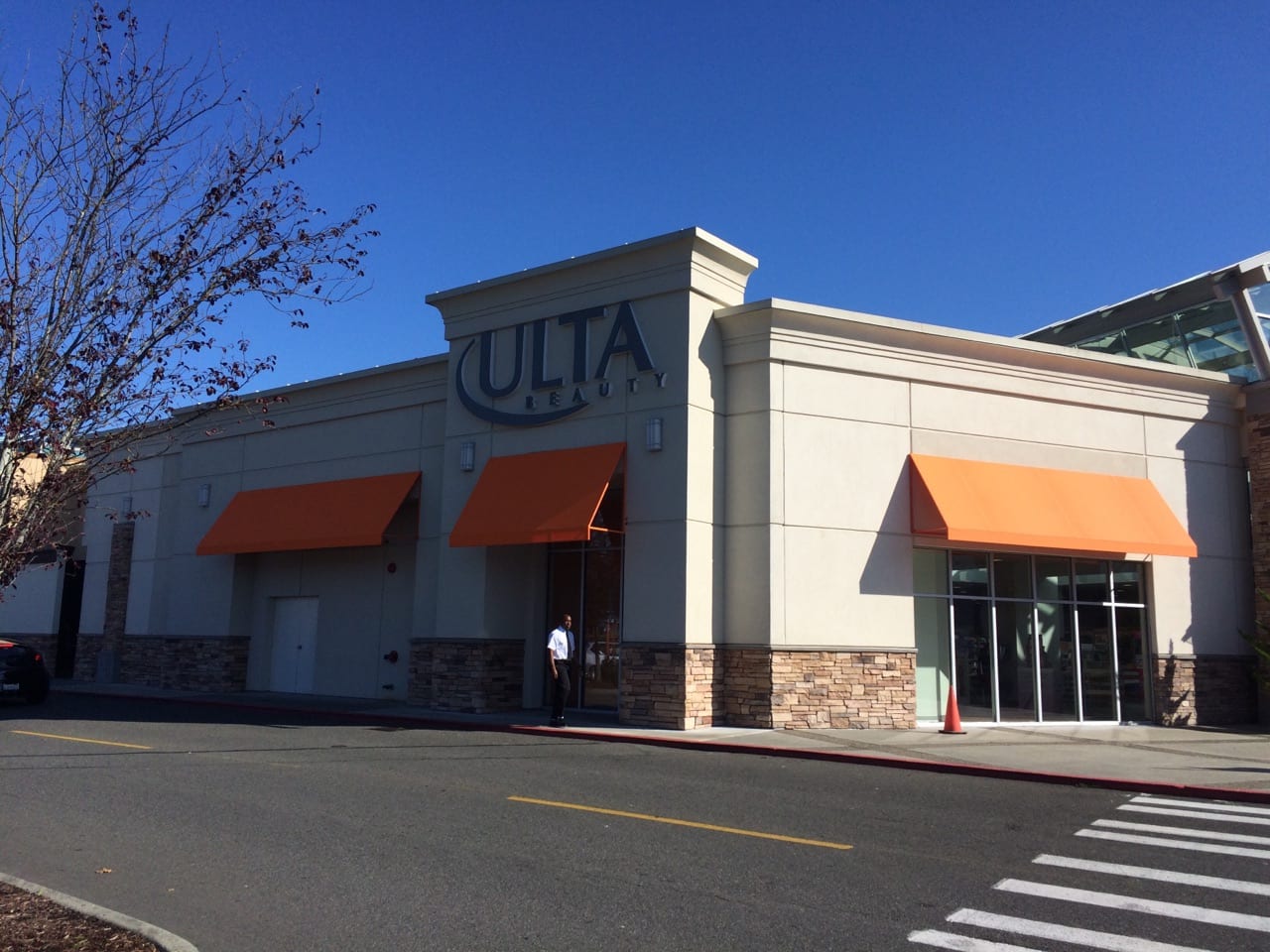 Ulta retail store with orange awnings attached to the building